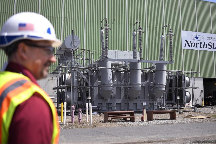 This April 29, 2019 photo shows the main transformer, no longer in service at Vermont Yankee Nuclear Power Station in Vernon, Vt. In January, privately held NorthStar Group Services completed the purchase of Vermont Yankee from New Orleans-based Entergy after federal and state regulators approved the sale of the reactor, closed since 2014. It marked the first permanent transfer of an operating license to a nuclear cleanup specialist for accelerated decommissioning. (AP Photo/Jessica Hill)