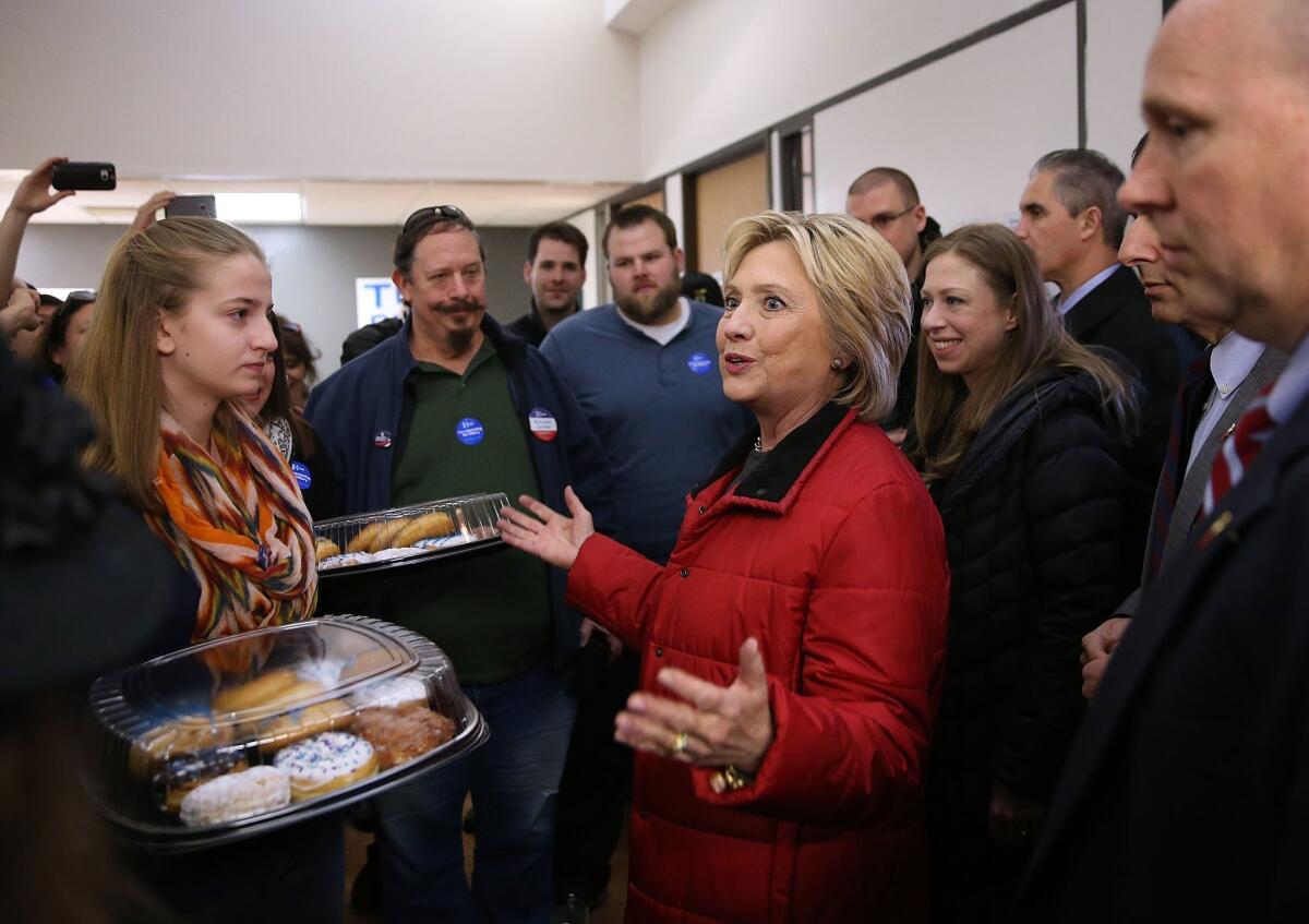 Hillary Clinton delivers doughnuts to campaign workers Monday in Des Moines.