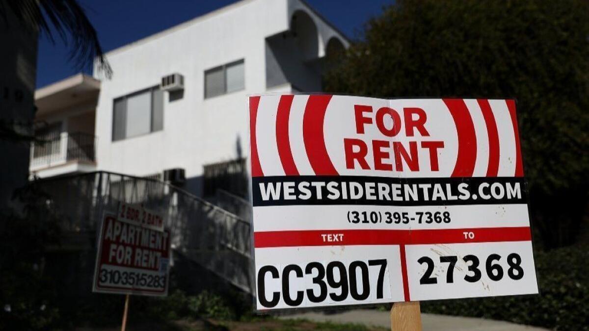 A for-rent sign is posted in front of an apartment building in Los Angeles in 2017.