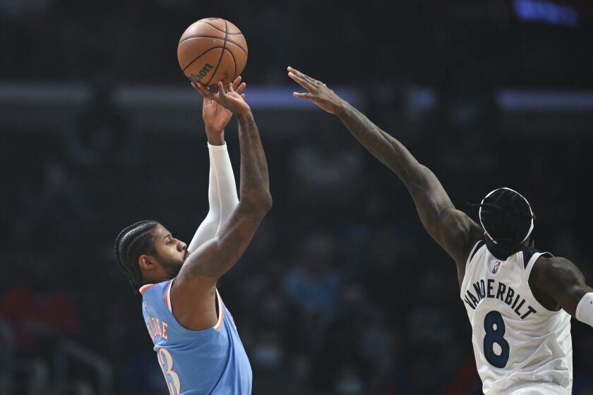 The Clippers' Paul George shoots over the Timberwolves' Jarred Vanderbilt on Nov. 13, 2021.