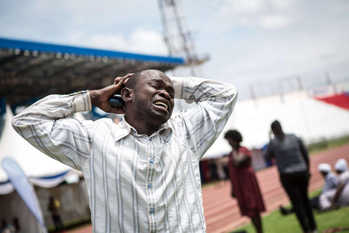 A man is overcome with grief Sunday at Nyayo Stadium in the Kenyan capital, Nairobi, after learning that a relative was killed by Somalia's Shebab Islamists during a siege at Garissa University College.