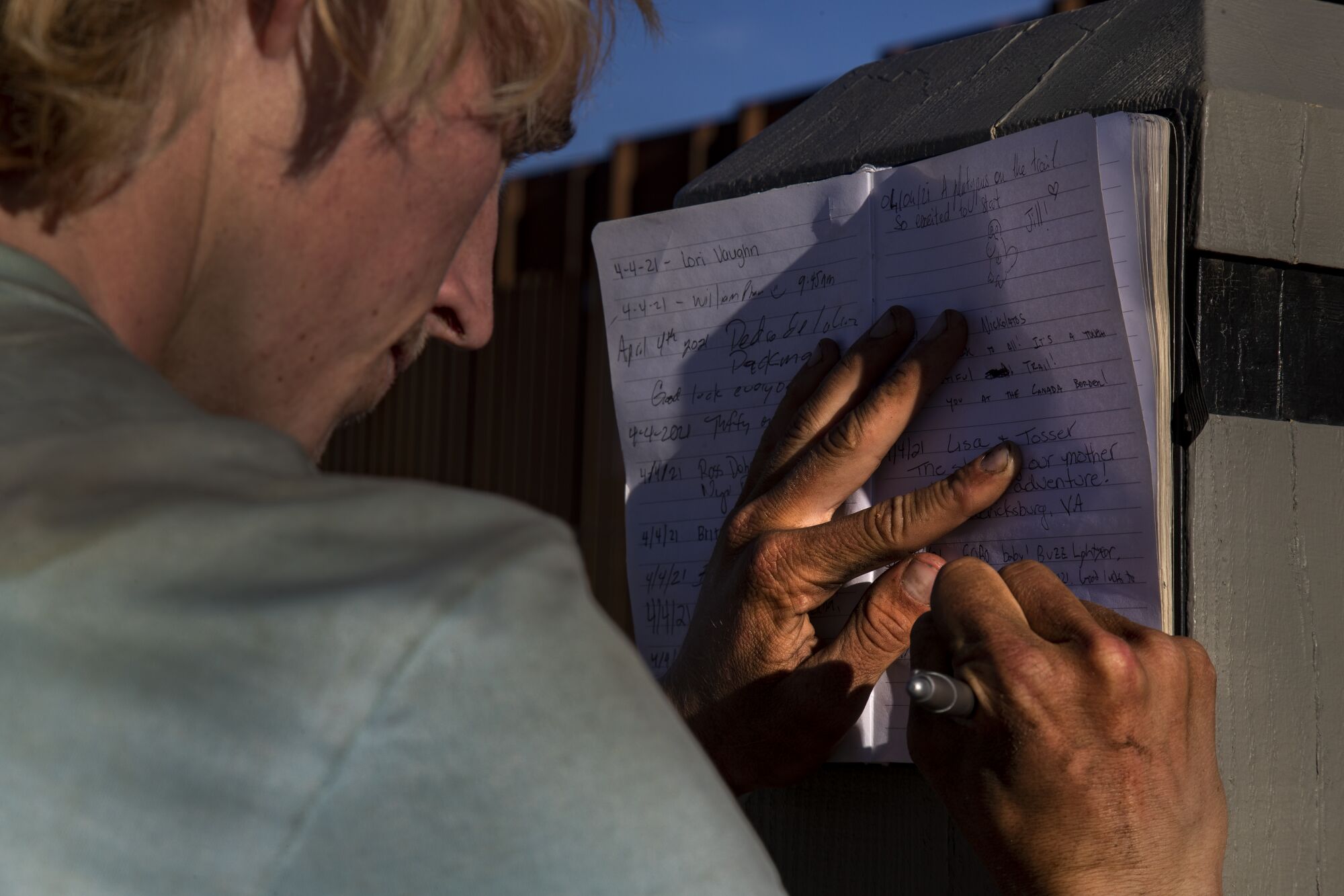 Jackson Parell signs the Pacific Crest Trail log book 