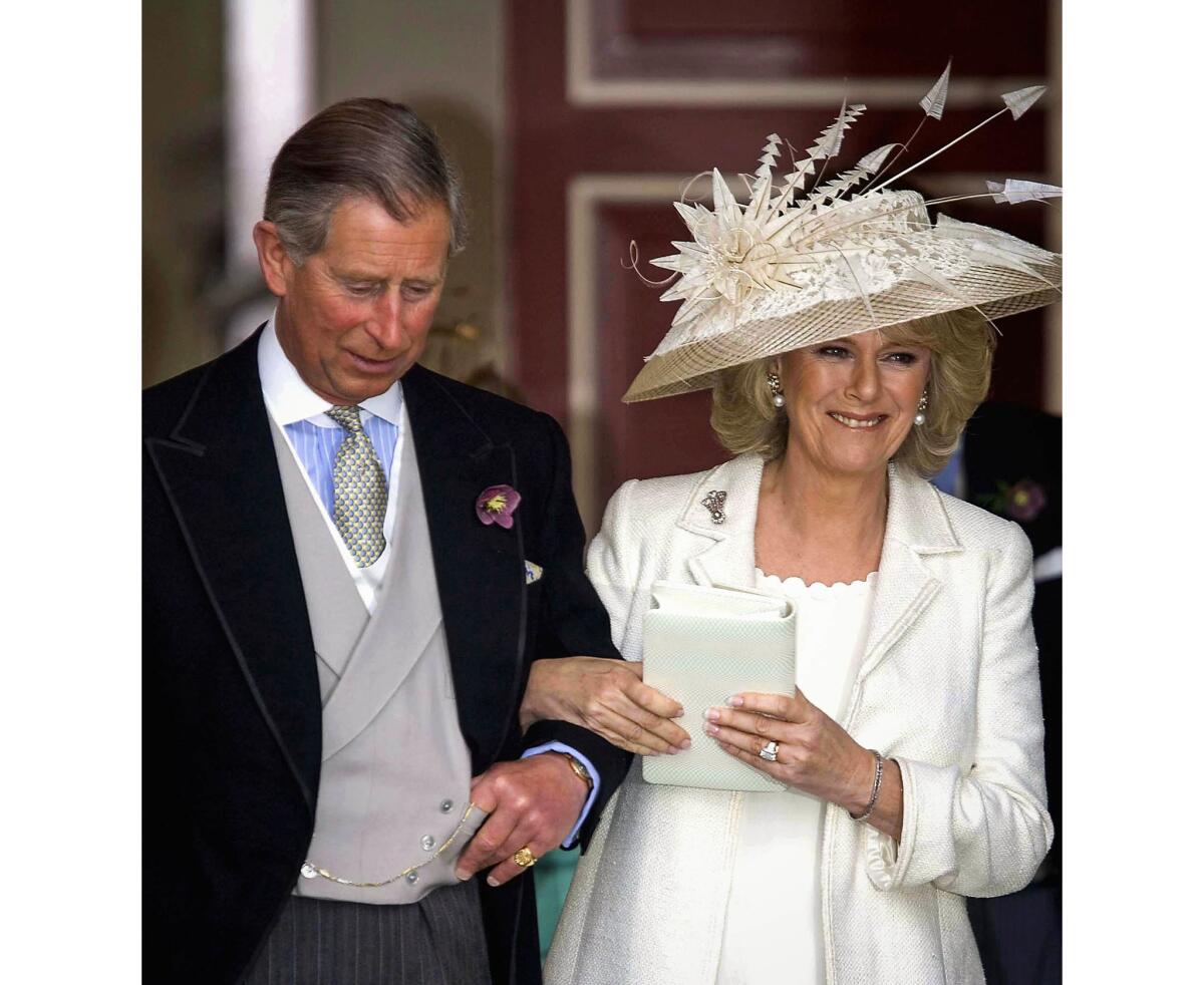 April 9, 2005: Prince Charles with Camilla Parker-Bowles on their wedding day. She wore clothing by Robinson Valentine and a hat by Philip Treacy for their civil ceremony marriage at the Guildhall, in Windsor, England.