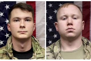 This combo of undated photo provided by the US Army shows, Spc. Jeremy Daniel Evans, 23, left, and Spc. Brian Joshua Snowden, 22. U.S. Army officials have identified Snowden and Evans as the two soldiers who were killed when their large transport vehicle crashed while heading to a training area in interior Alaska. (US Army via AP)
