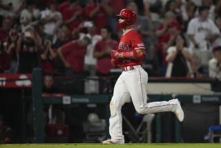 Los Angeles Angels' Logan O'Hoppe runs the bases after hitting a home run during the sixth inning of a baseball game against the Cleveland Guardians in Anaheim, Calif., Friday, Sept. 8, 2023. Eduardo Escobar also scored. (AP Photo/Ashley Landis)