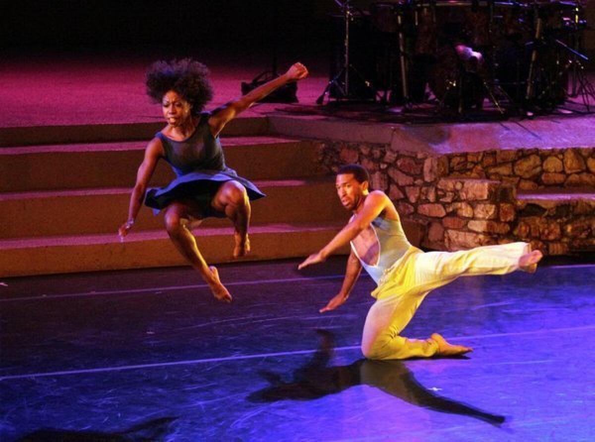 Khilea Douglass, left, and Micah Moch of the L.A.-based Lula Washington Dance Theatre perform Saturday night at the John Anson Ford Amphitheatre.
