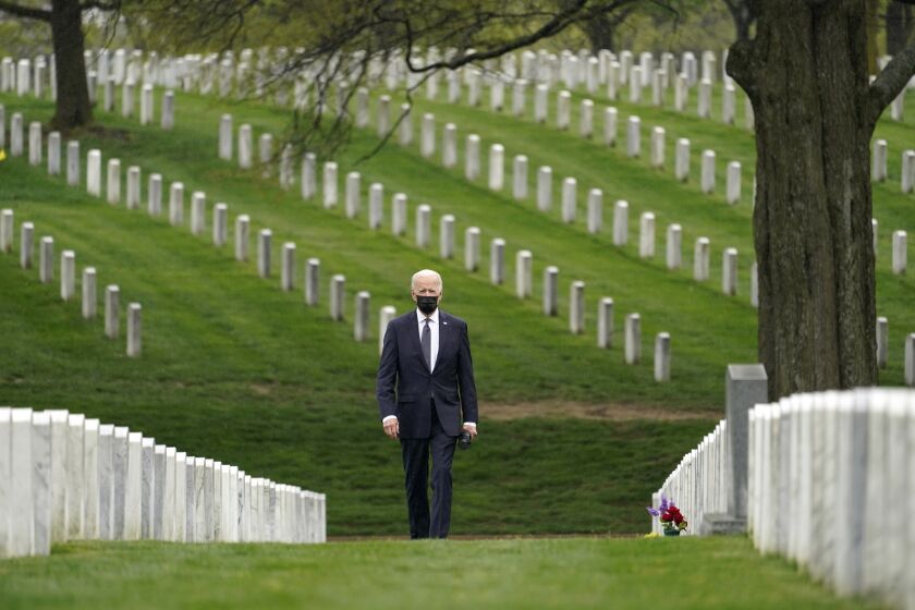 President Biden visits Arlington National Cemetery in April. 