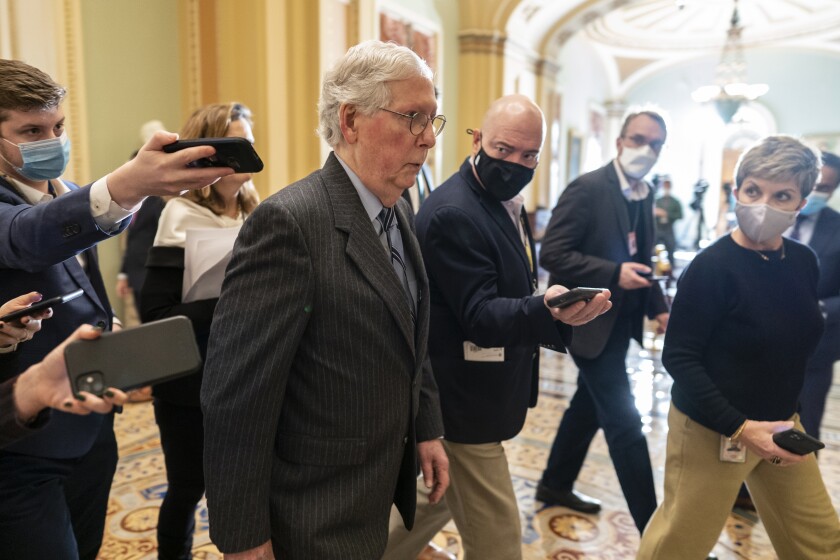 Senate Minority Leader Mitch McConnell, R-Ky., walks to the Senate chamber followed by reporters on Capitol Hill in Washington, Tuesday, Dec. 7, 2021.(AP Photo/Carolyn Kaster)