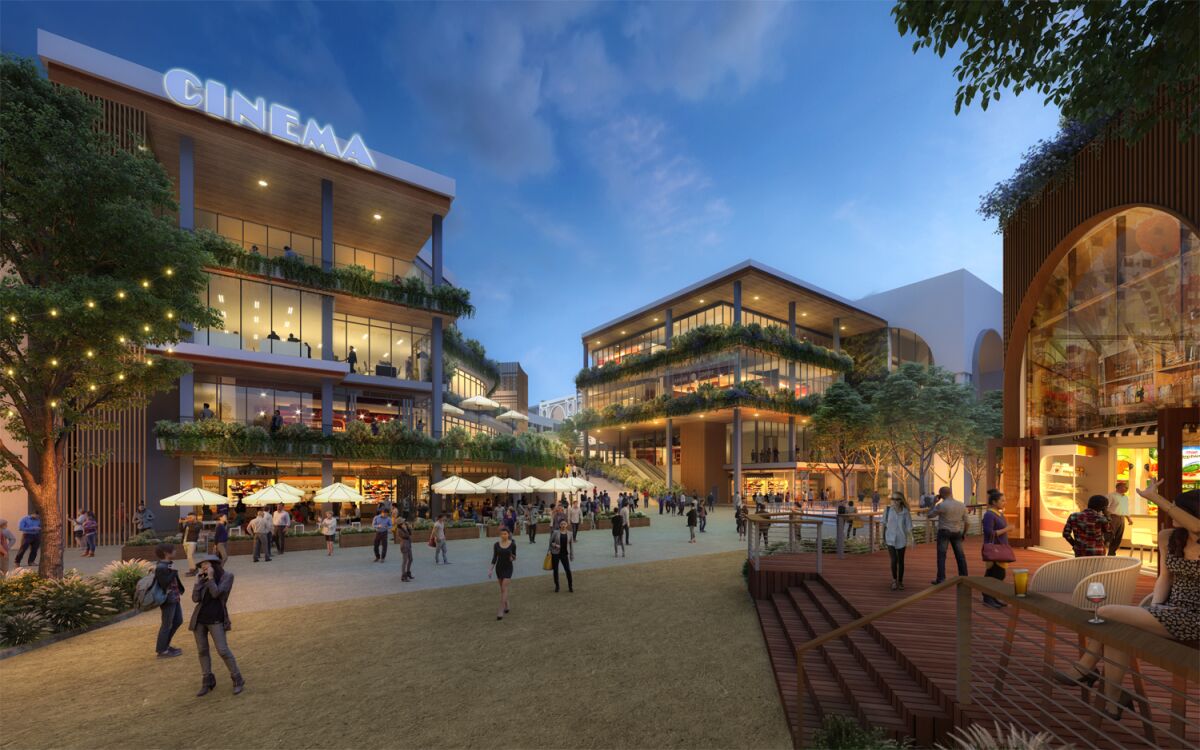 An artist rendering shows The Campus at Horton from the perspective of someone standing facing the plaza's entryway from Horton Plaza Park. On the left, a luxury cinema concept replaces the former multi-plex on the top story of the building, with two floors of office below it, and food and beverage options on the ground floor. On the far right, steps lead up to the Bradley Building, where a food hall is envisioned.