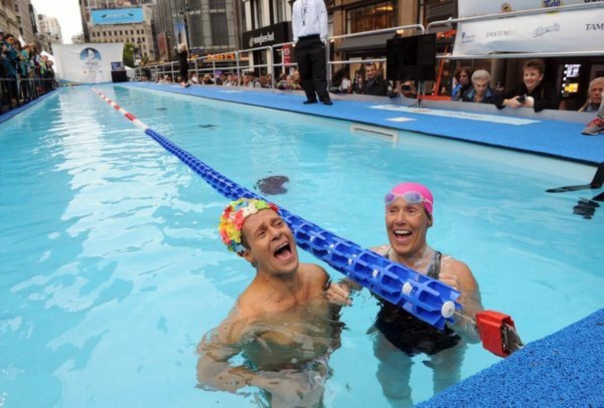 Fitness star Richard Simmons visits Diana Nyad in a pool in Manhattan during Nyad's 48-hour charity swim for victims of Superstorm Sandy.