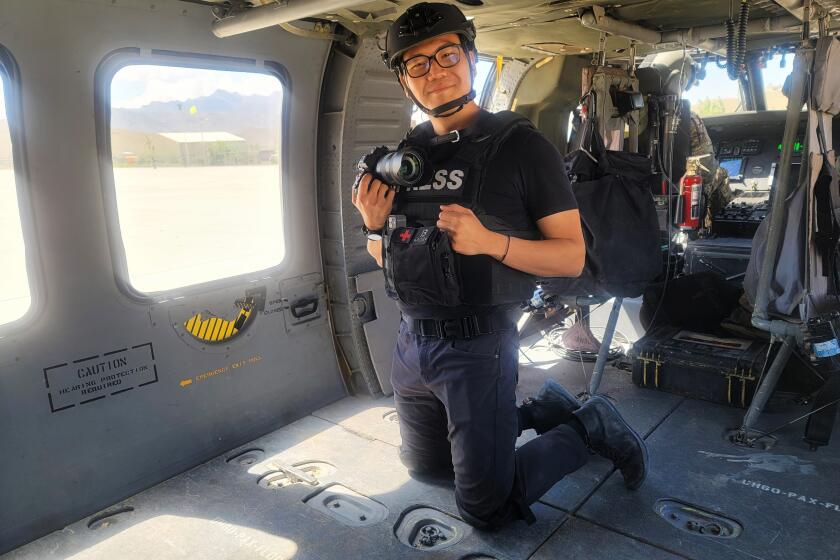 Los Angeles Times foreign correspondent and photojournalist, Marcus Yam filying on an Afghan Air Force UH-60 Blackhawk helicopter on a resupply mission in Gardez, Afghanistan on May 9, 2021. Exactly a year later, Yam won the Pulitzer for breaking news photography;