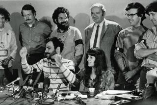 The Chicago Seven defendants hold a news conference in Chicago, Ill., during their 1969 trial on charges of conspiracy to riot at the 1968 Democratic National Convention. From left, standing, are: Abbie Hoffman, John Froines, Lee Weiner, Dave Dellinger, Rennie Davis and Tom Hayden. Seated is defendant Jerry Rubin, with his girlfriend, Nancy Kurshan, who was not part of the trial. (AP Photo)