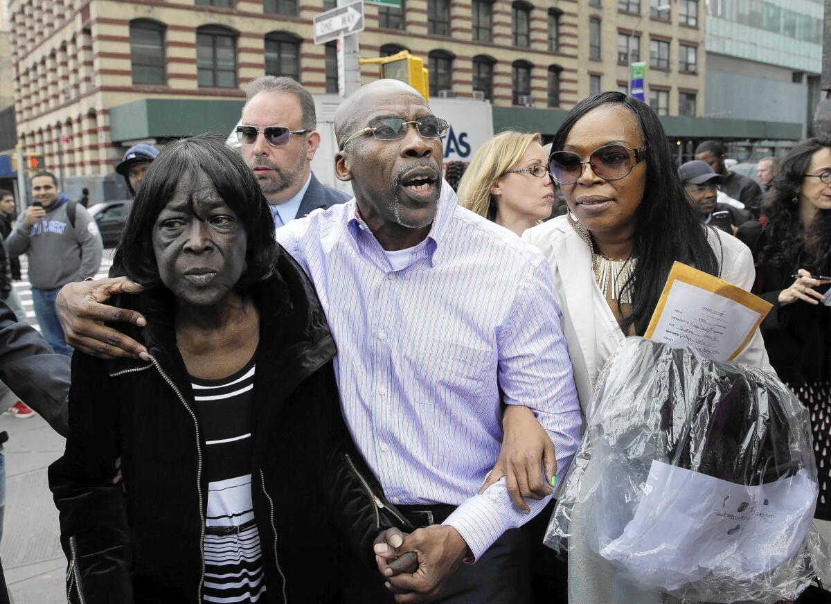 Jonathan Fleming, with his mother, Patricia Fleming, left, and ex-wife, Valerie Brown, leaves a New York courthouse a free man after he was exonerated of a murder for which he served nearly 25 years.