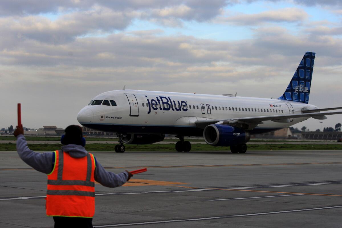 A Jet Blue flight taxis at Long Beach Airport in this Dec. 12, 2012 file photo. Southwest Airlines has applied to add nine daily flights out of Long Beach.