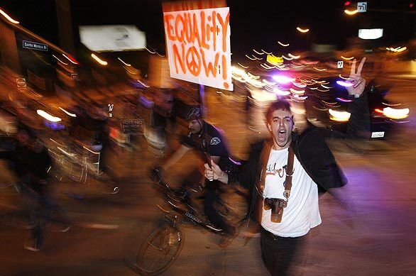 Samir Naji, 19, of Agoura Hills walks east on Santa Monica Boulevard through Century City protesting the passage of Proposition 8.