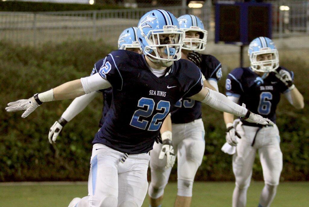 Corona del Mar High's Hugh Crance (22) reacts after recovering a blocked punt during the first half against Nordhoff in the CIF State Southern California Regional Division III Bowl Game at LeBard Stadium in Costa Mesa on Saturday.