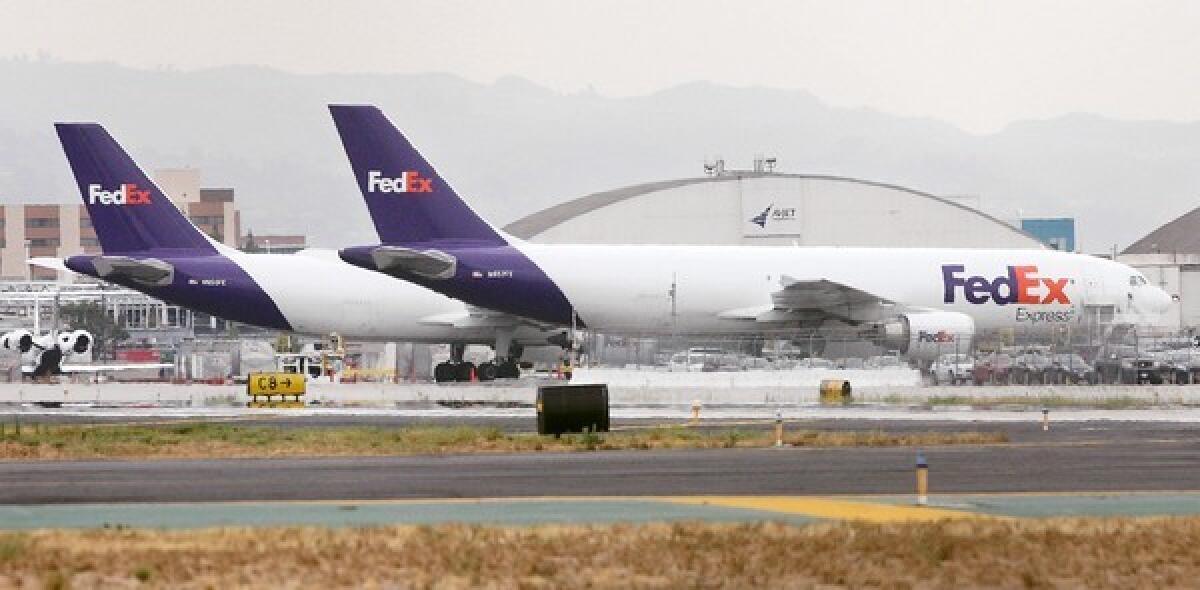 Fedex planes parked on the tarmac at Bob Hope Airport in Burbank on Wednesday, July 10, 2013. There may be a possible mandatory curfew put in place at the airport which would affect deliveries by cargo planes in the early morning.