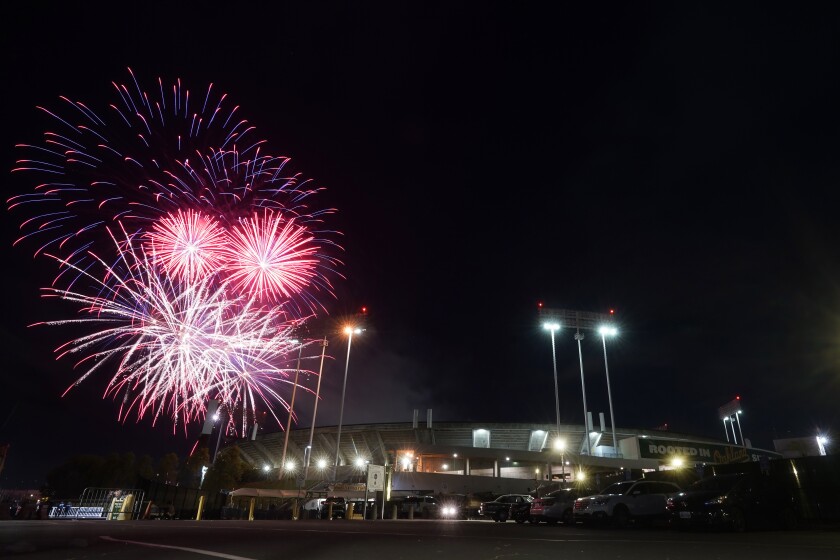 Fireworks erupt over RingCentral Coliseum after a baseball game between the Oakland Athletics and the Toronto Blue Jays in Oakland, Calif., Monday, July 4, 2022. (AP Photo/Jeff Chiu)