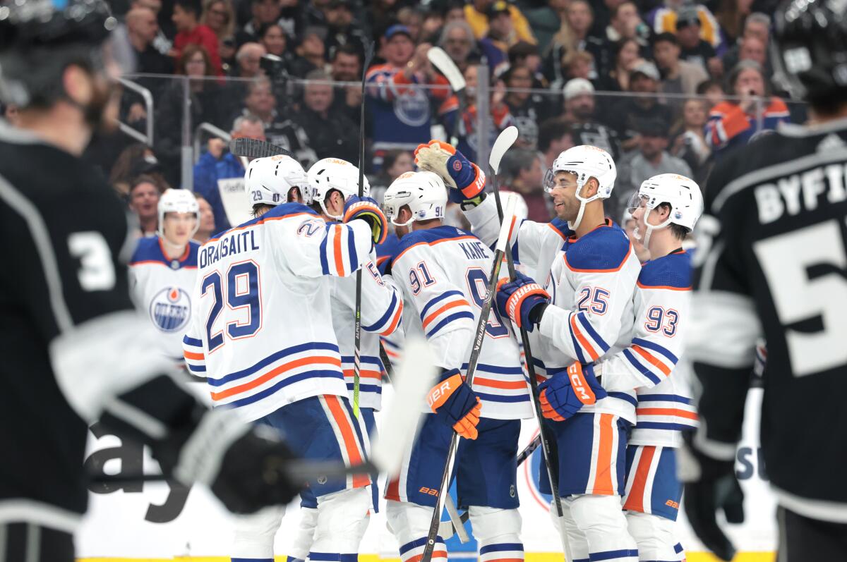 Edmonton Oilers players celebrate after a goal by Evander Kane (91) in the second period.