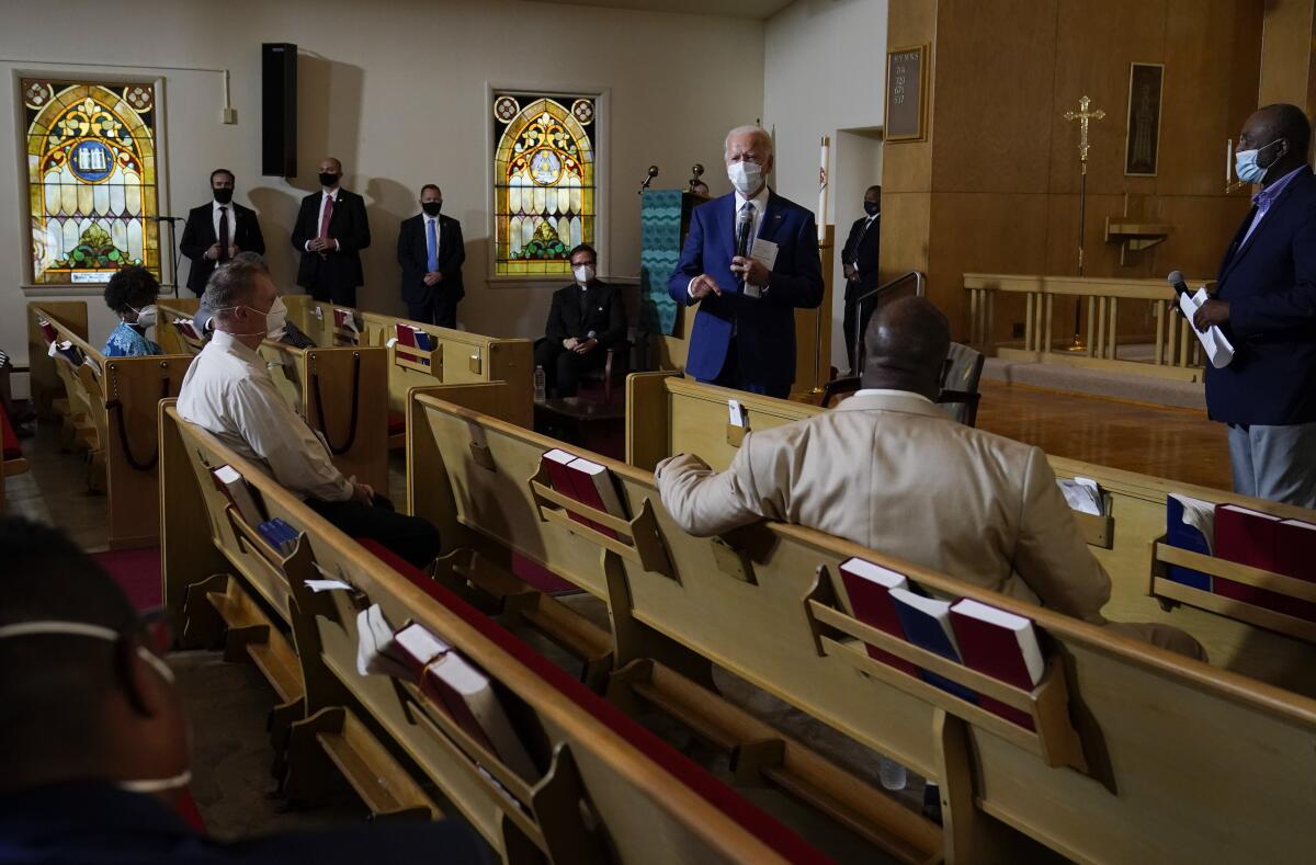 Joe Biden speaks with members of the community at Grace Lutheran Church in Kenosha, Wis.