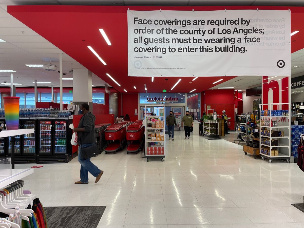 Signage inside a Target advertises a mask mandate