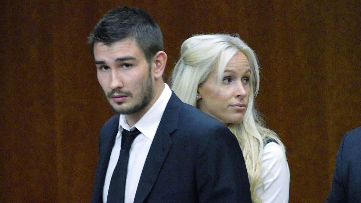 Former Kings defenseman Slava Voynov stands in a Torrance courtroom next to his wife, Marta Varlamova, in July 2018.