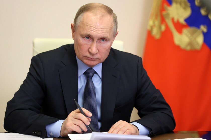 Russian President Vladimir Putin chairs a meeting of the Presidential Council for Civil Society and Human Rights via a video conference call at the Novo-Ogaryovo state residence, outside Moscow, Russia, Thursday, Dec. 9, 2021. (Mikhail Metzel, Sputnik, Kremlin Pool Photo via AP)
