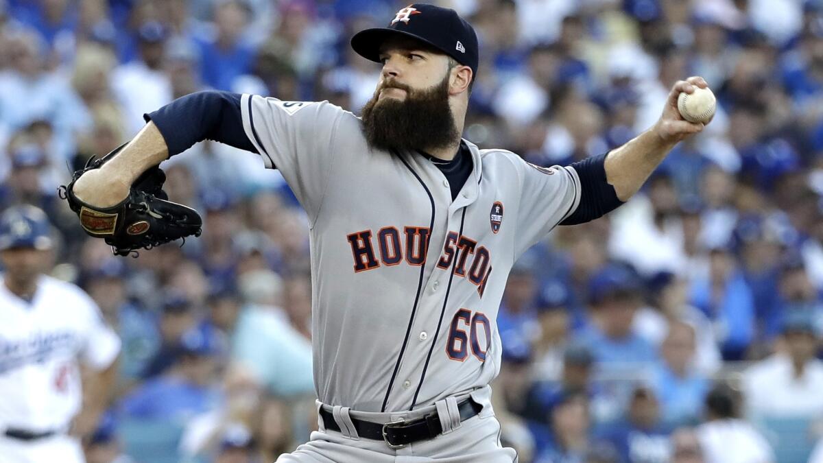 Astros starting pitcher Dallas Keuchel delivers a pitch during the first inning of Game 1.