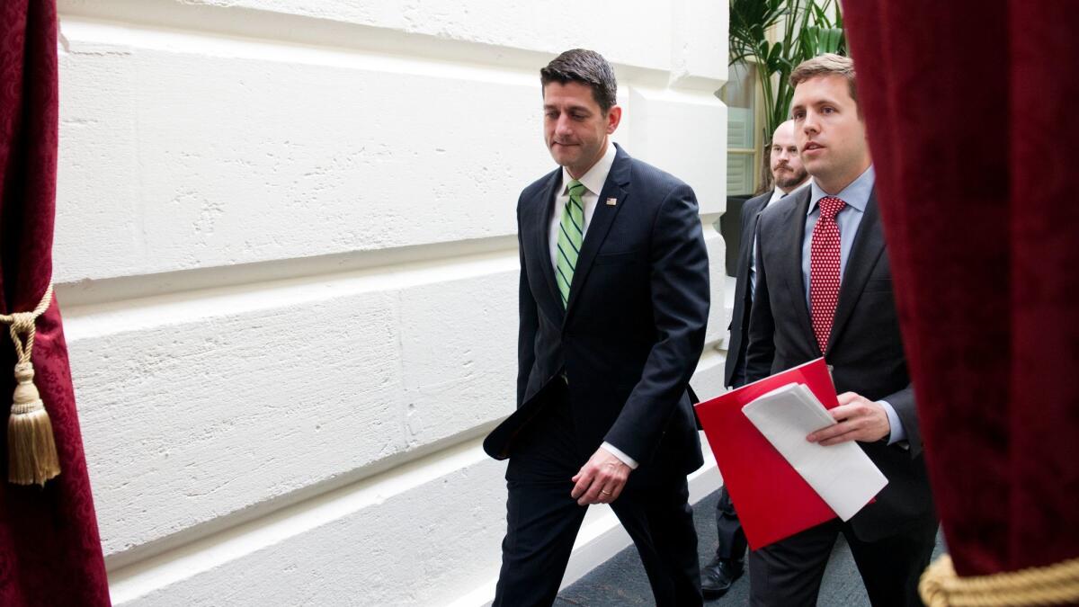 House Speaker Paul D. Ryan leaves the Republican Caucus meeting on Capitol Hill on Tuesday.