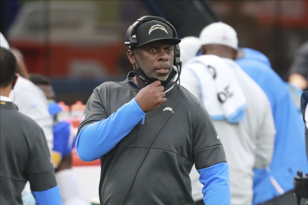 Chargers coach Anthony Lynn looks on from the sideline during a game.