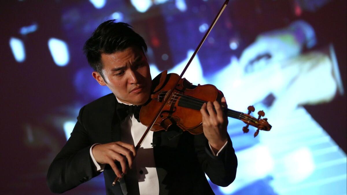 Violinist Ray Chen, performing in London, and the L.A. Phil are holding a competition called Play With Ray, which offers the chance to play onstage with Chen at the Hollywood Bowl on Aug. 8.