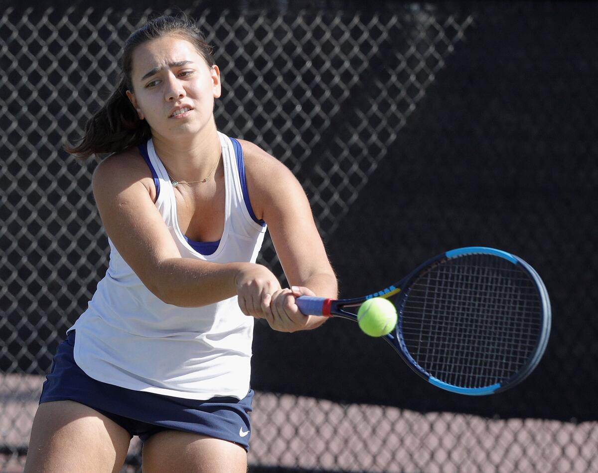 Crescenta Valley Melinka Mohammed reaches to keep a Hoover serve in play in a semifinal singles match in the Pacific League girls' tennis semifinals and finals at Burroughs High School on Wednesday, October 30, 2019. A couple of the contests were second-round contests, played today because of poor air quality on Monday.