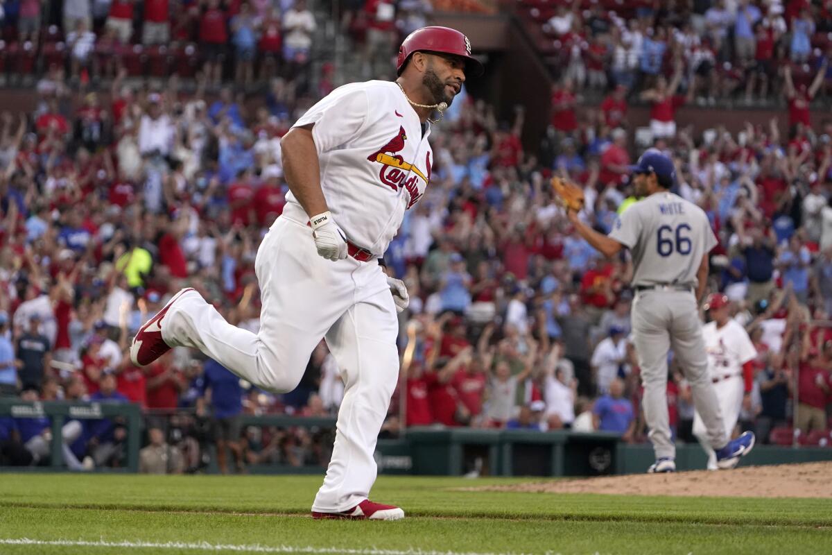 St. Louis Cardinals' Albert Pujols rounds the bases after hitting a solo home run off Dodgers pitcher Mitch White.