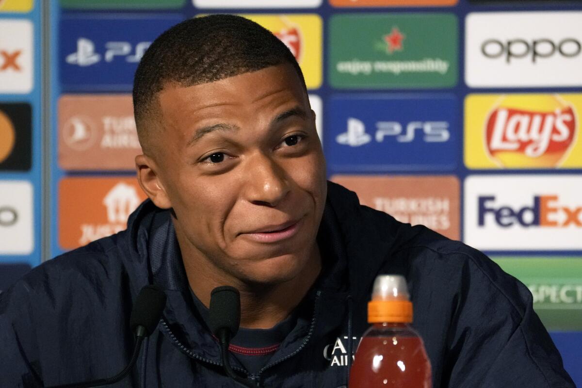 PSG's Kylian Mbappe gives a press conference at the Parc des Princes stadium, in Paris, Monday, Sept. 5, 2022. Paris Saint Germain will play against the Juventus in a Champions League soccer match Group H on Tuesday. (AP Photo/Thibault Camus)