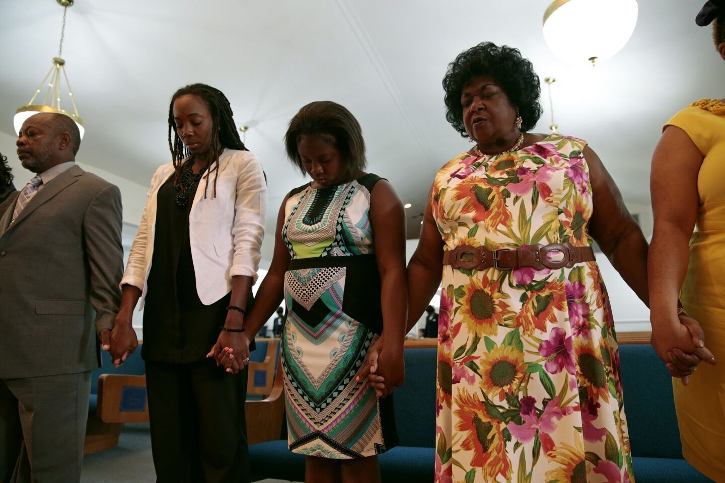 On the day after George Zimmerman was found not guilty, people gather in prayer at the First Shiloh Baptist Church in Sanford.