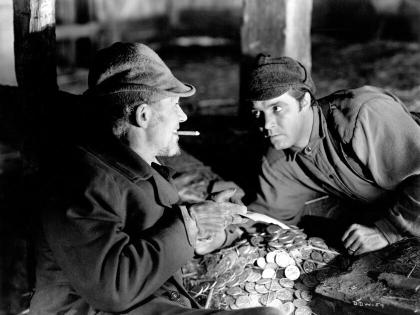 Walter Huston, left, and James Craig in 1941's "All That Money Can Buy" directed by William Dieterle.