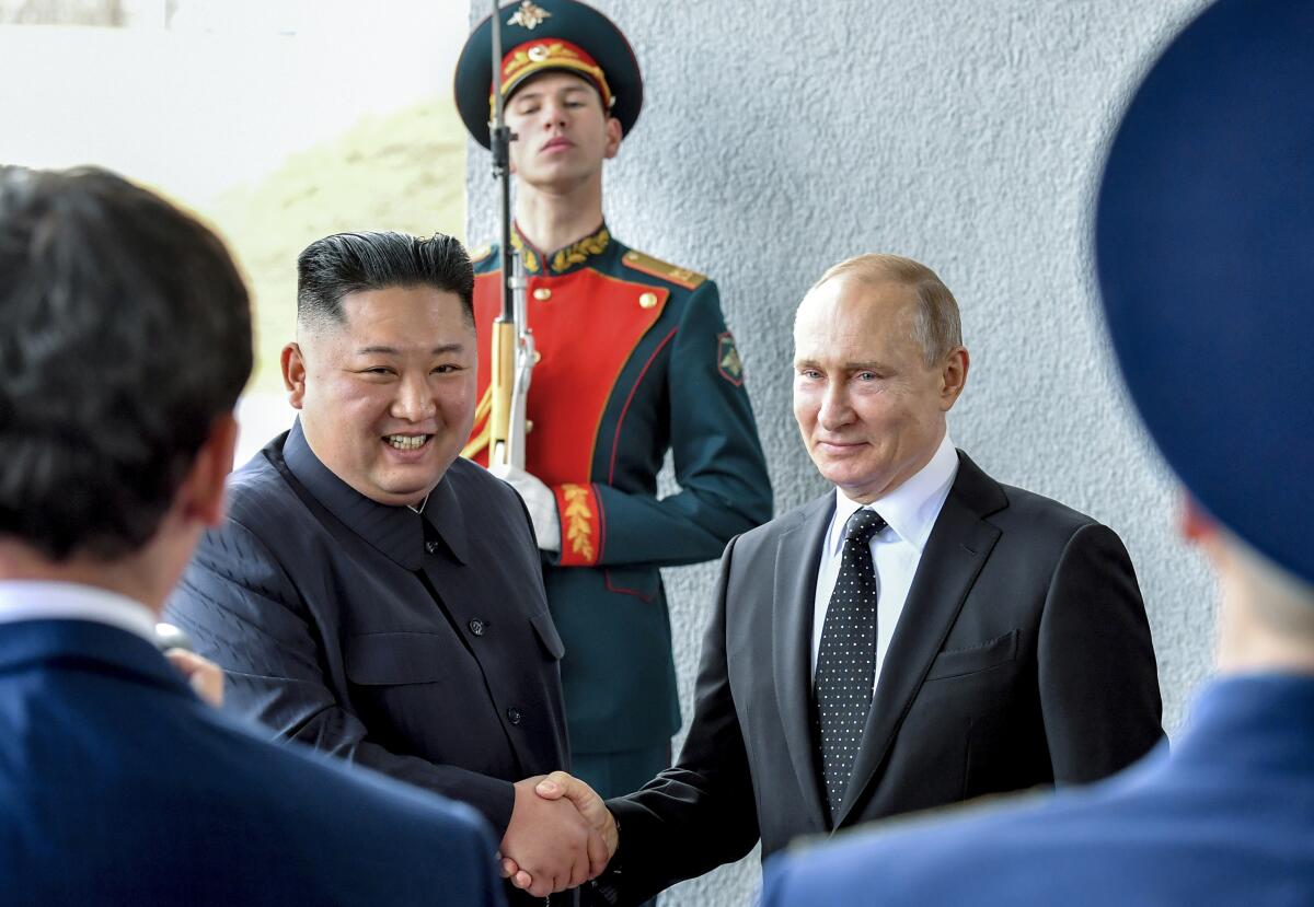 North Korean leader Kim Jong Un shaking hands with Russian President Vladimir Putin