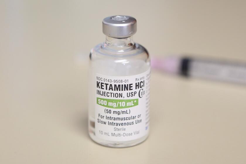 FILE - In this July 25, 2018, file photo, is a vial of ketamine, which is normally stored in a locked cabinet, in Chicago. A drug called ketamine that's injected as a sedative during arrests has drawn new scrutiny since a young Black man named Elijah McClain died in suburban Denver. An analysis by The Associated Press of policies on ketamine and cases where it was used nationwide uncovered a lack of police training, conflicting medical standards and nonexistent protocols that have resulted in hospitalizations and even deaths. (AP Photo/Teresa Crawford, File)