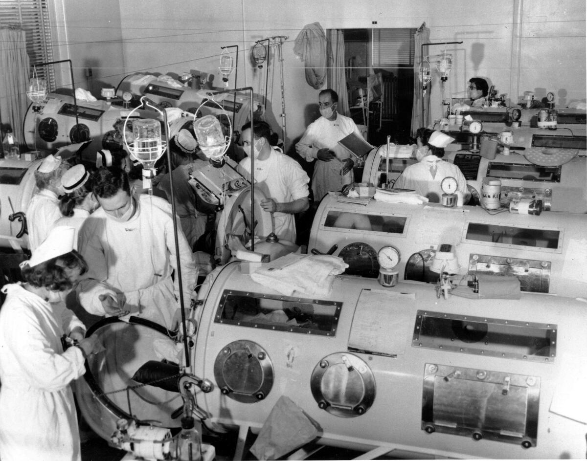 Iron lungs are used in an emergency polio ward in the 1950s.