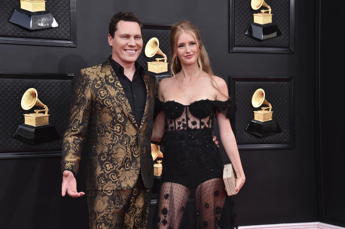 Tiesto, left, and Annika Backes Verwest arrive at the 64th Grammy Awards