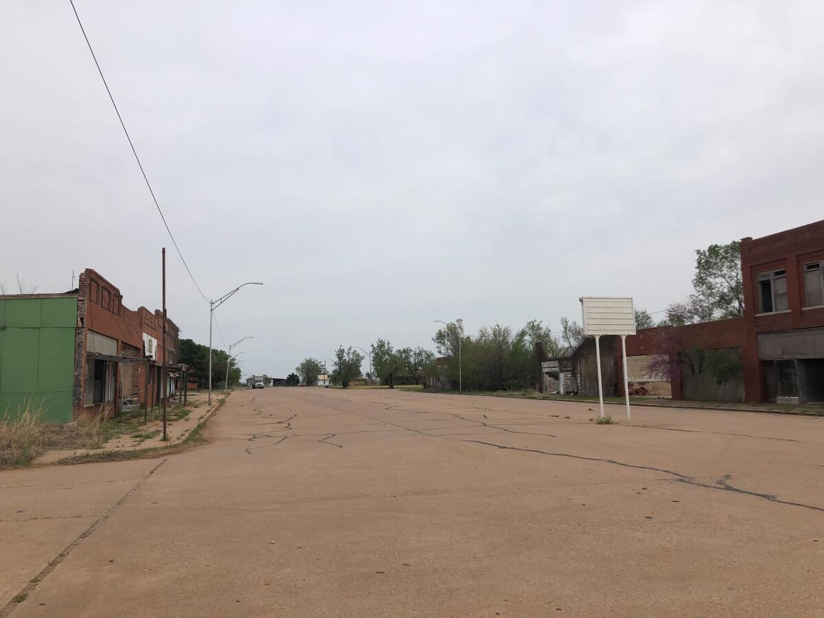 Buildings flank a wide and deserted thoroughfare 