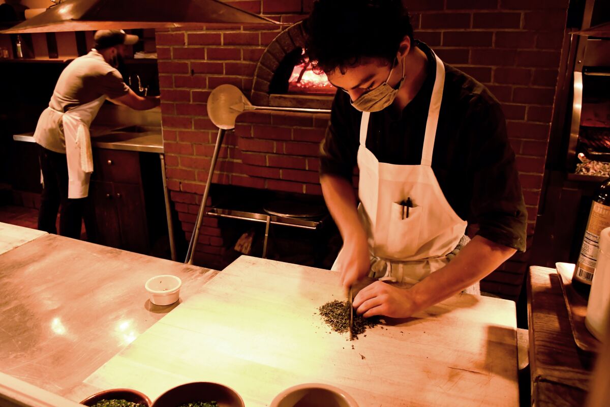 A person prepares food.