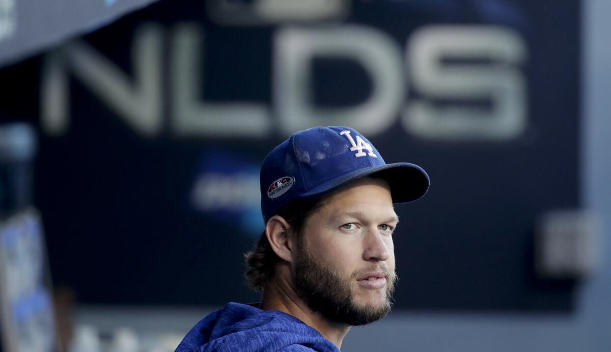 Clayton Kershaw sits in the dugout before Game 1.