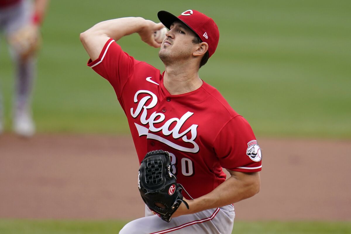 Cincinnati Reds starting pitcher Tyler Mahle delivers during the first inning of a baseball game against the Pittsburgh Pirates in Pittsburgh, Thursday, Sept. 16, 2021. (AP Photo/Gene J. Puskar)