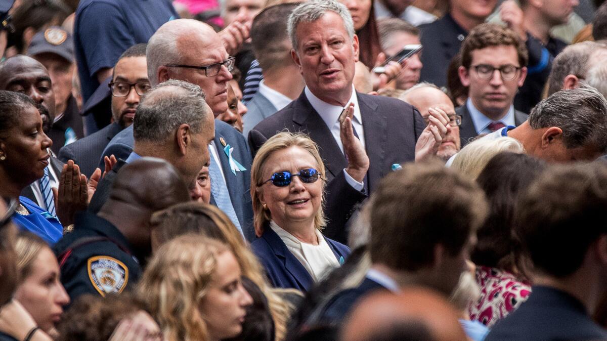 Democratic presidential candidate Hillary Clinton, center, attends a ceremony at the Sept. 11 memorial, in New York.