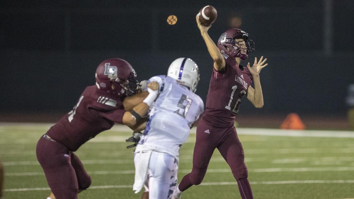 Quarterback Andrew Johnson threw for four touchdowns in his first start for Laguna Beach High on Friday.