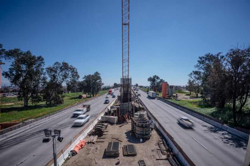 Traffic on Highway 99 passes High Speed Rail construction at the Cedar Viaduct in Fresno