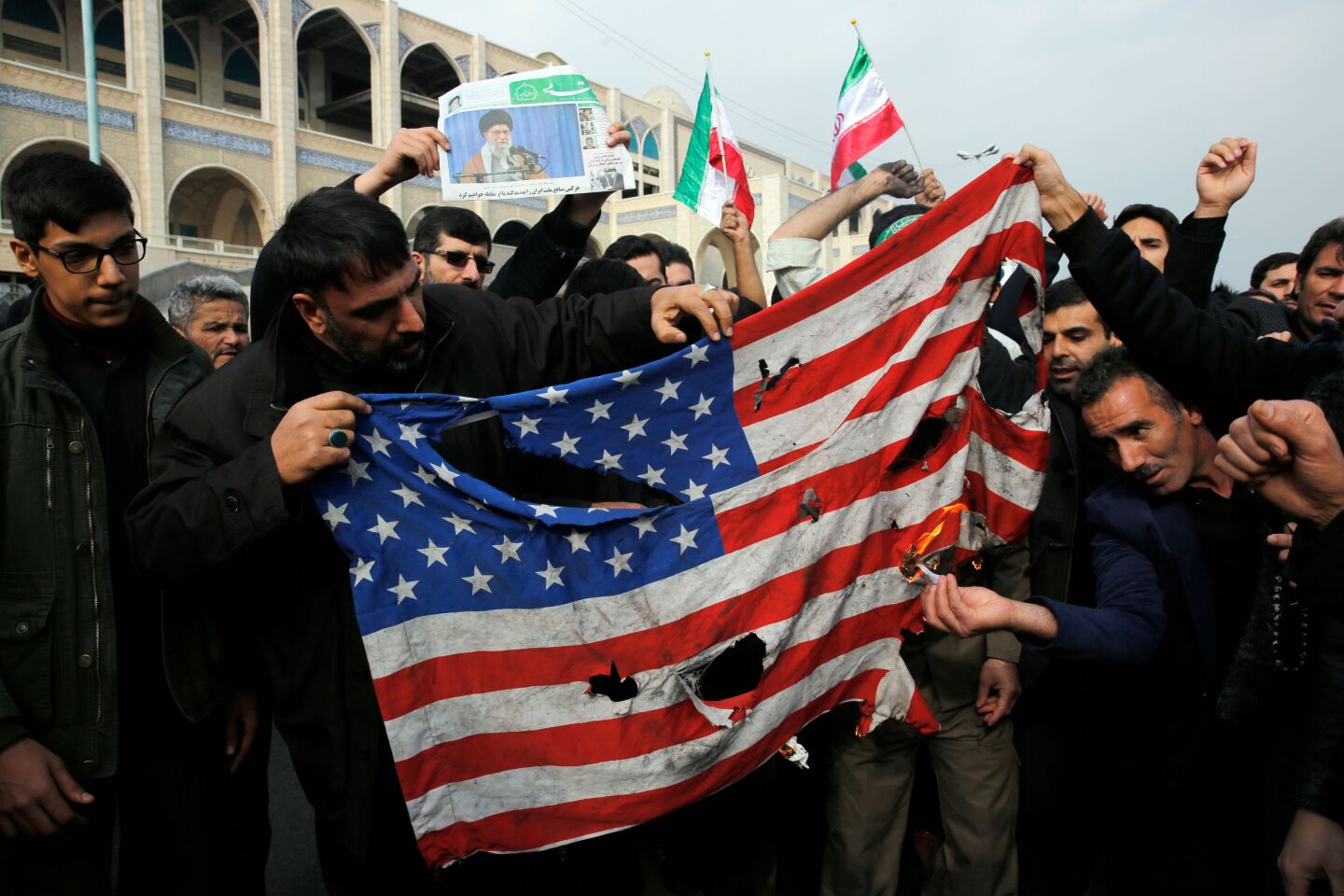 Iranians burn a U.S. flag during a protest in Tehran to condemn Suleimani's killing.