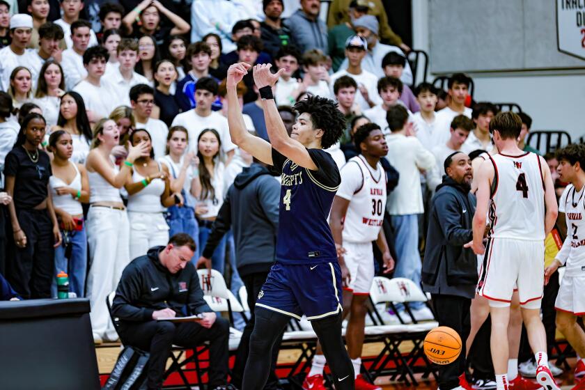 Tyran Stokes of Sherman Oaks Notre Dames tries to fire up the crowd after the Knights come back from 15-point deficit.