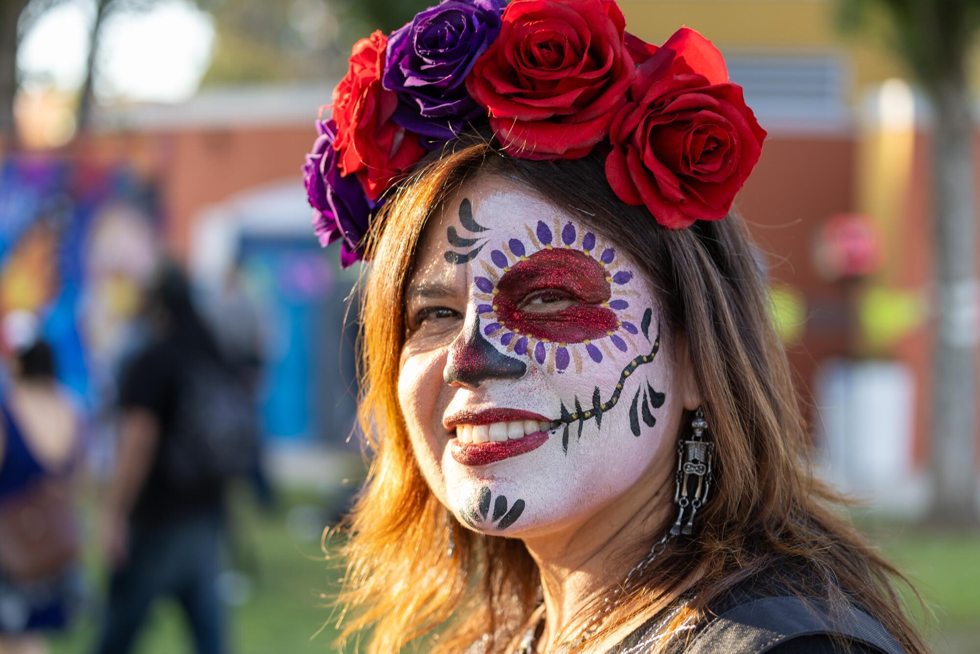 Patricia Esquivel wears calavera face makeup during Self Help Graphics 50th annual Dia De Los Muertos event 